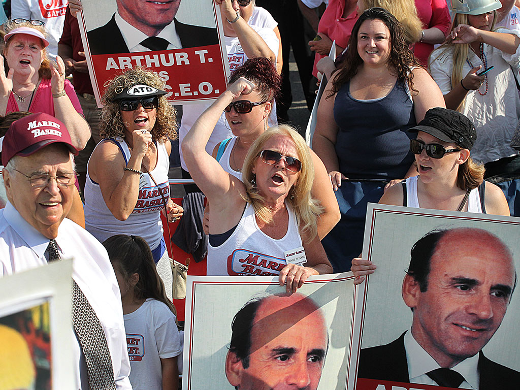 Employees and customers hold a rally in support of Arthur T. Demoulas after he was ousted from his role at Market Basket by a board controlled by his cousin, Arthur S. Demoulas