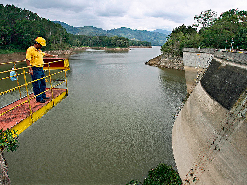 An ICE operator looks at the water level at the Cachi dam in Costa Rica