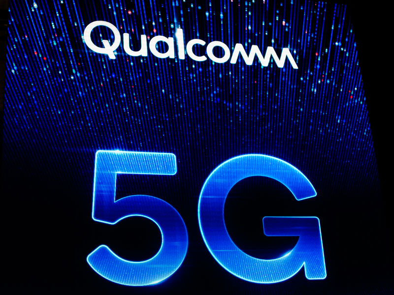 The Qualcomm 5G logo exhibited during this year's Mobile World Congress. The company's chips are expected to be used once again in Apple products following the settlement